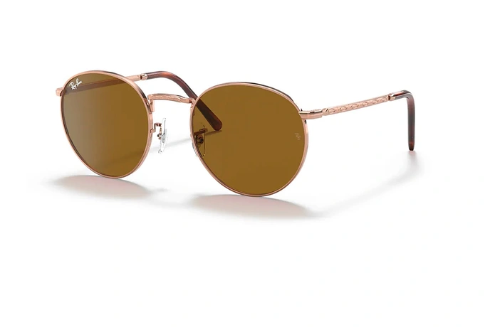 عینک آفتابی ری بن مدل گرد طرح جدید فریم فلزی رزگلد و عدسی قهوه ای - عکس از زاویه سه رخ
