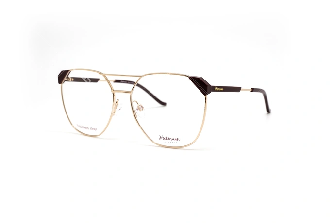 عینک طبی زنانه هیکمن فریم گرد گربه ای رنگ طلایی مشکی - عکس از زاویه سه رخ