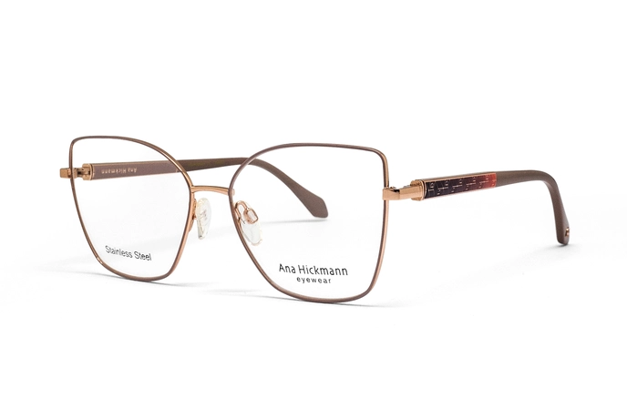 عینک طبی پروانه ای فلزی آنا هیکمن با فریم رز گلد و دسته های کرم  - عکس از زاویه سه رخ