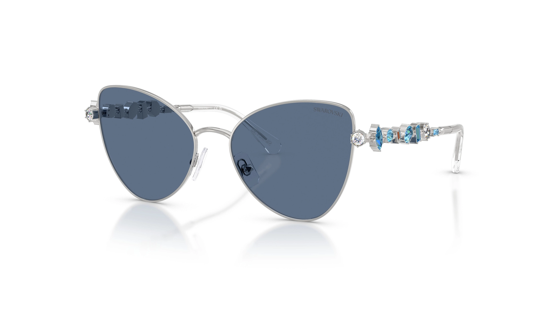 عینک آفتابی زنانه سواروسکی مدل Swarovski SK7034S با فریم نقره‌ای، عدسی آبی و کریستال‌های آبی و سفید - زاویه سه رخ